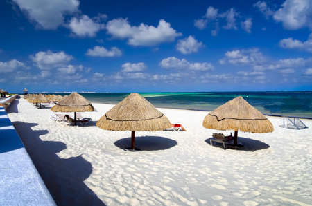 Tourists enjoying the  tropical ocean climate on the beach in Cancun, Mexicoの写真素材