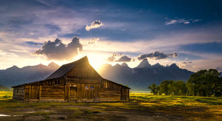 Sunset over the iconic Moulton barn on Mormon Row in Grand Teton National Park, WYの写真素材