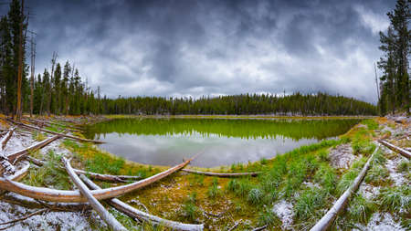 Scaup Lake panorama on a gloomy, snowy September day in Yellowstone National Park, WYの写真素材