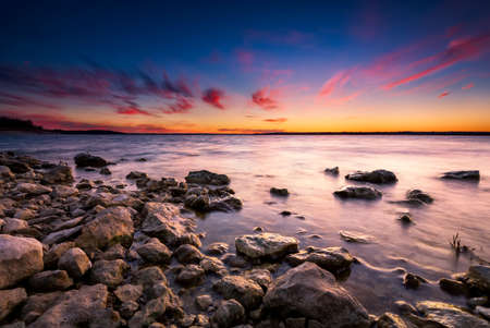 Colorful sunset over Benbrook Lake in North Texasの写真素材