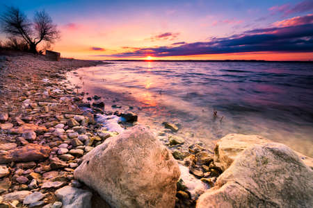 Colorful sunset over Benbrook Lake in North Texasの写真素材