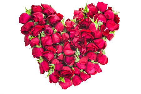 Heart-shaped arrangement of red roses isolated on whiteの写真素材