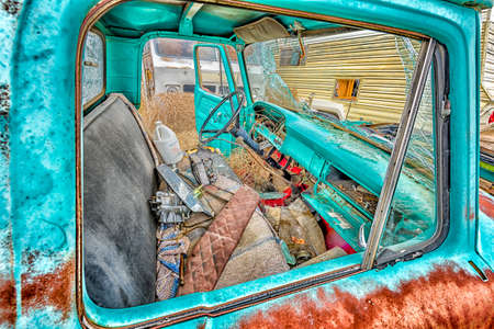Abandoned, shattered motor vehicles in the ghost town of Cisco, Utahの写真素材