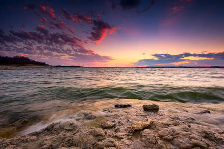 Colorful sunset over Benbrook Lake in North Texasの写真素材