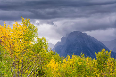 Dreary late afternoon view of the northern edge of the Teton Range as fall arrivesの写真素材