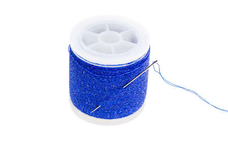 Highly detailed closeup view of blue thread wound on a spool  isolated on a white background