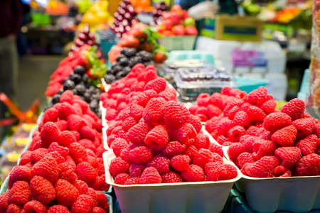 Containers of fresh raspberries on display in a Canadian grocery store