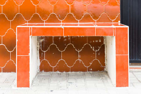 Distinctive orange tile bench and wall in Cozumel, Mexicoの写真素材
