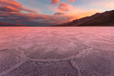 Crimson Sunrise Over the Salt Flats in Badwater Basinの写真素材