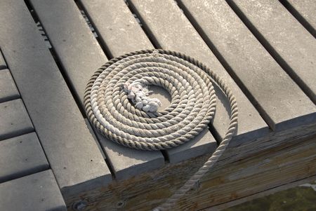 Coiled rope on the boat dockの写真素材