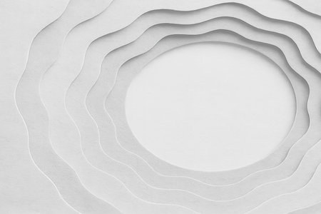 An elegant and clean abstract background featuring multiple wavy, paper-cut-like layers in shades of white and light grey, creating a sense of depth and dimension. A central circular area provides ample copy space, making it ideal for minimalist designs, presentations, or contemporary branding. The subtle textured surface adds a sophisticated touch.の素材