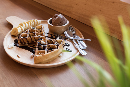 Belgian waffles with fruit and chocolate, forest fruit, all homemade, delicious batterの写真素材