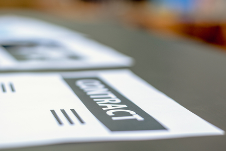 Contract documents on the desk in the office.
