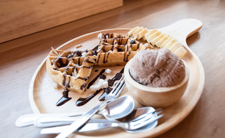 Belgian waffles with fruit and chocolate, forest fruit, all homemade, delicious batterの写真素材