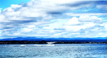 The blue sky and white clouds with planeのeditorial素材