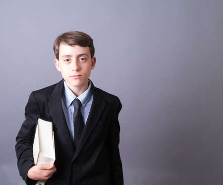 Young Attorney or businessman with large bookの写真素材