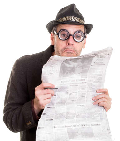 Funny man reading the newspaperの写真素材