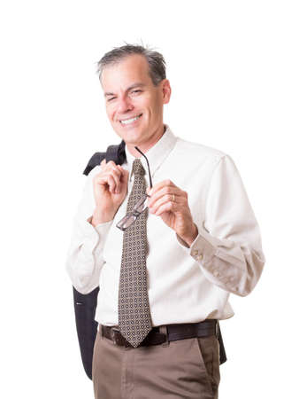Smiling business man with jacket over shoulderの写真素材