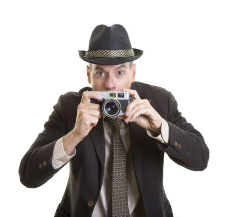 Man taking photograph with vintage film cameraの写真素材