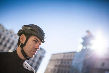 man with cycling helmet on the cityの写真素材