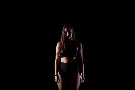 woman dancer on black front portraitの写真素材