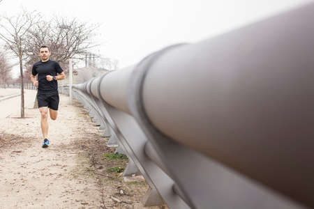 black runner near pipesの写真素材