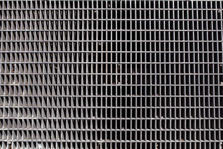 metal grid on the street over underground line