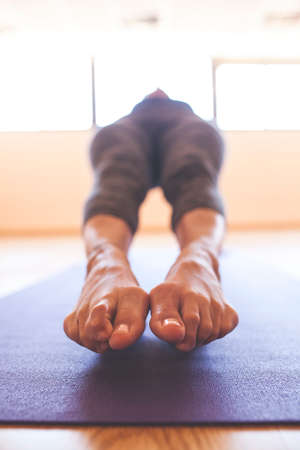 Yogi arches the back face up, view of the feetの写真素材