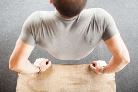 training jumping box on his backの写真素材