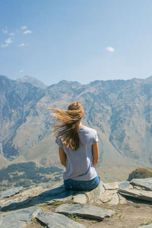 Hiker with backpack Hiking on the top of the mountain a Young Woman, a Girl. A Healthy Active...