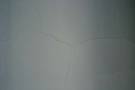 The texture of the white wall. Background. Embossing.