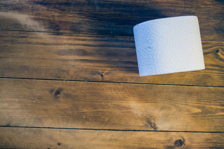 Toilet paper on wood backgroundの写真素材