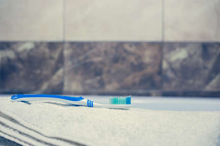 Blurred bathroom interior background and white spa towels on Marble Bathtub Mirror Faucet Toothbrush razorの写真素材
