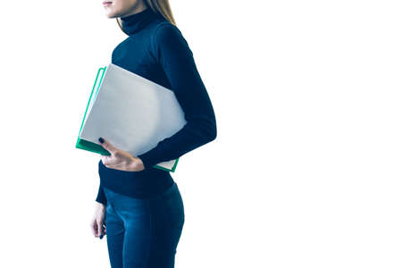 A girl with a folder of papers on white background. isolate.の写真素材