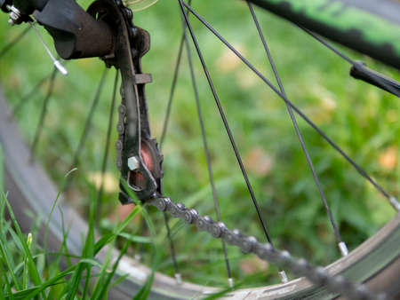 Closeup of a bicycle gears mechanism and chain on the rear wheel of mountain bike. Rear wheel...