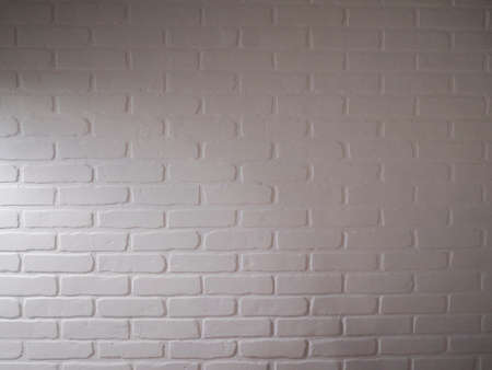 Abstract wallpaper texture stone brick pattern old stucco light gray and aged paint white brick wall background.の写真素材