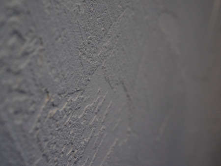 White abstract background or texture of concrete wall with rough stucco. Textured damaged plaster,...