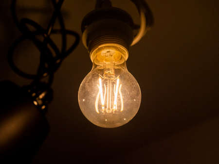 Light bulb Edison close-up. Diode lamps in the loft style room. The light in the dust