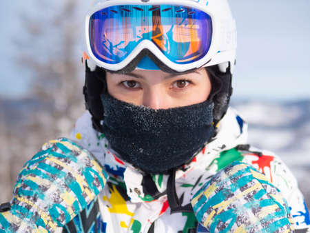 Happy girl on ski resort. Snowboarder on vacation. Lifestyle Concept Adventure winter physical activities.の写真素材