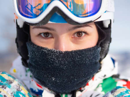 Happy girl on ski resort. Snowboarder on vacation. Lifestyle Concept Adventure winter physical activities.の写真素材