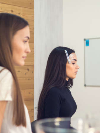 Master works with hairstyles. She paused to wait. Master client I see. Pause.. master blurred