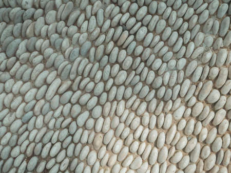 Stone pavement background with rough granite boulders. The texture of the historic medieval...