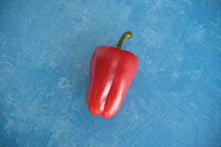 bulgarian red pepper. On a light blue background of oil paint. Food backgroundの写真素材