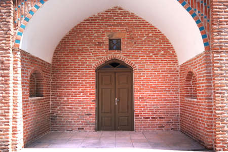 Background arches, wooden doors and red ancient brickwork. Blue Mosque yerevanの写真素材
