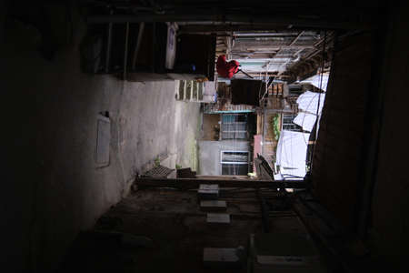 Georgia Tbilisi - 08.08.2021: Courtyard with old residential buildings and a stone path in the Central part of the cityの写真素材