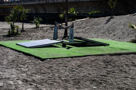 table tennis dismantled on a beach