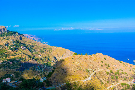 Panorama of mountains and the sea in Sicilyの写真素材