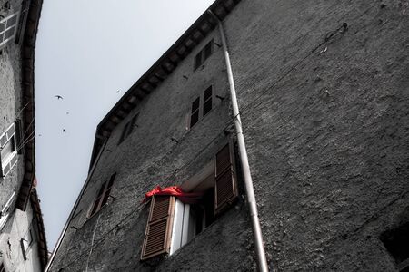 Red curtain on the window of an ancient palaceの写真素材