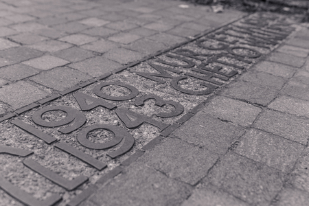 Commemorative plaque in the Jewish ghetto of Warsaw, in black and whiteのeditorial素材