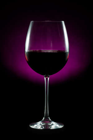 Red wine isolated on black backgroundの写真素材